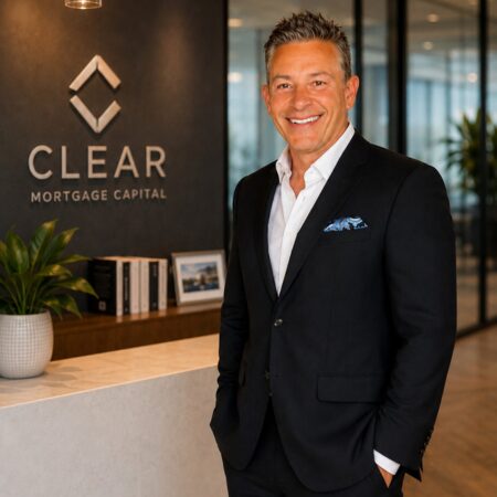 Smiling man in business attire at office.